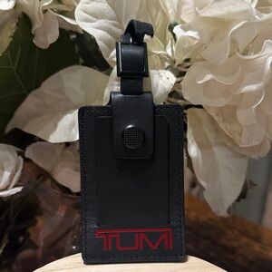Tumi Black and Red Luggage Tag NEW BUT DAMAGED STRAP SEE PICTURES